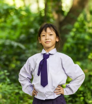 Asian girl student relaxing  in the park