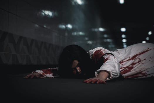 Horror bloodthirsty woman ghost horror she death and scary at dark night in tunnel, The girl was hit by a car and lying died on the road. full of blood left unattended, Happy halloween day festival