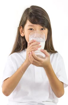 Young girl drinking milk in Studio on white