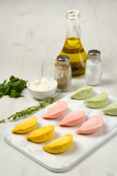 Frozen colorful dumplings with chicken and turkey ground meat
