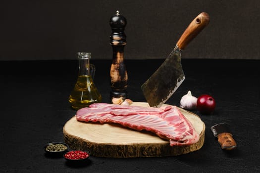Raw fresh lamb ribs, uncut with spices and herbs