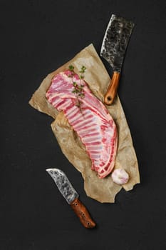 Top view of raw fresh lamb ribs, uncut on wrapping paper