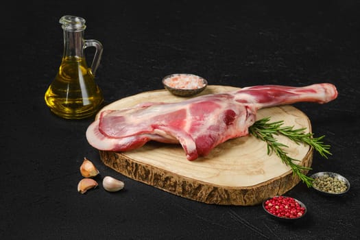 Raw fresh lamb shoulder on black background
