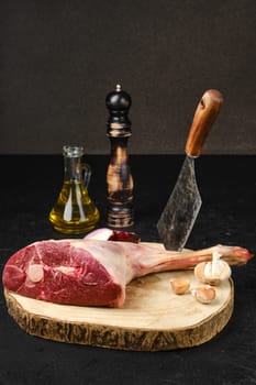 Raw fresh lamb short cut leg, sirloin off on wooden cut log