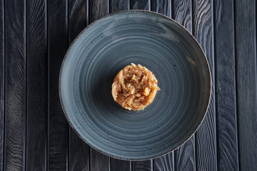 Top view of plate with onion marmalade. Candied onion jelly.