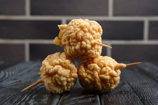 Snack for beer - deep fried cheese balls with sauce