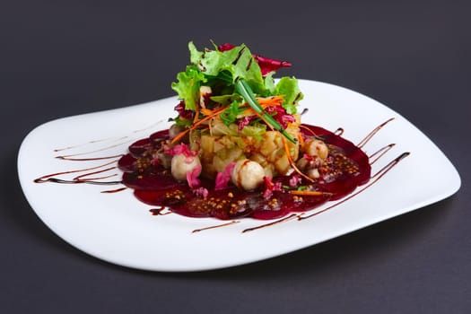 Lenten salad with beetroot, carrot, potato, pickled mushroom on a plate