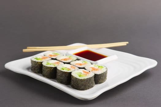 Set of rolls with salmon on plate