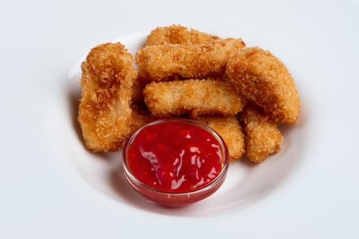 Deep fried chicken nuggets on a plate