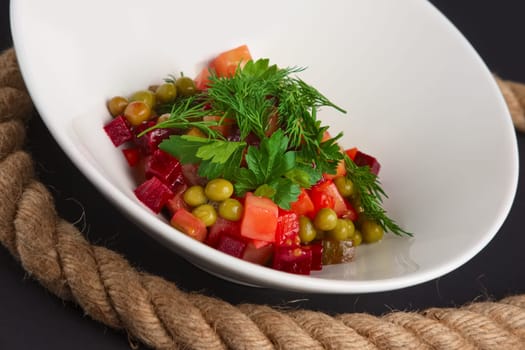 Traditional russian salad of beetroot - vinaigrette. Closeup view.