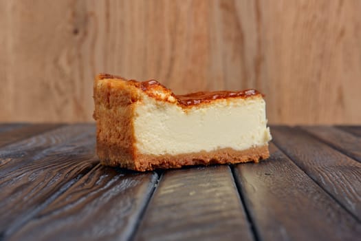 Piece of cheesecake on table