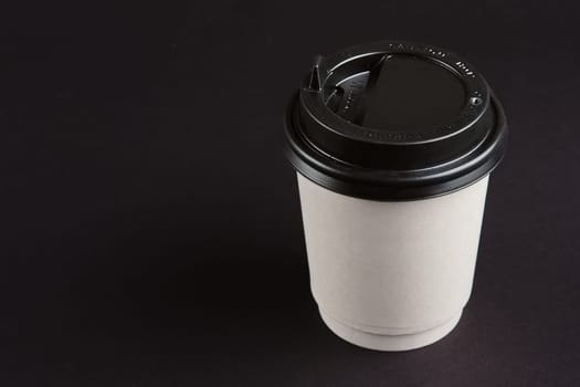 Cardboard cup with lid. Place for text.