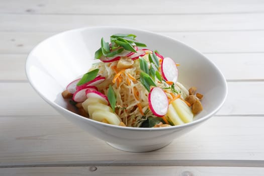 Salad with radish, cabbage, mushroom and potato