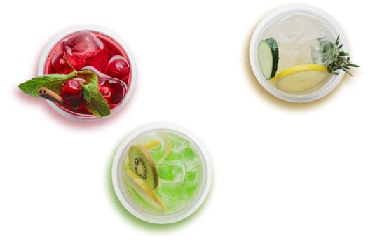 Top view of three glasses with cool lemonade isolated on white background