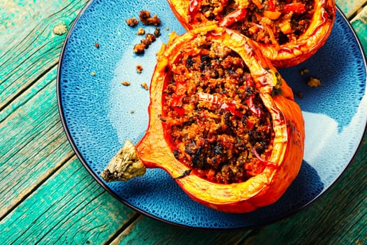 Pumpkin halves with minced meat,vegetables and quinoa.Seasonal pumpkin hokkaido