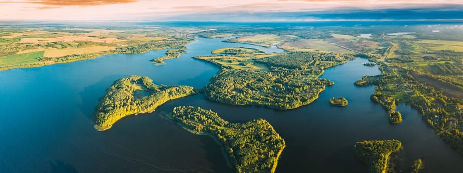 Lyepyel, Lepel Lake, Beloozerny District, Vitebsk Region. Aerial View Of Lyepyel Cityscape Skyline In Autumn Morning. Morning Fog Above Lepel Lake. Top View Of European Nature From High Attitude In Autumn. Bird's Eye View Of Island Pension Lode. Panormic View.