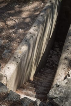 The entrance to a secret disguised military bunker. Abandoned bomb shelter. Background