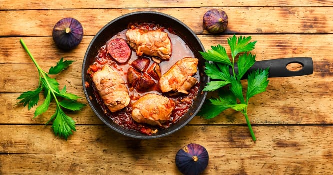 Chicken rolls with figs in wine sauce.Flat lay