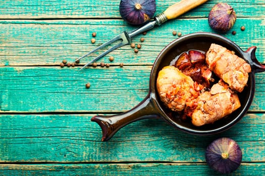 Chicken rolls with figs in wine sauce.Flat lay