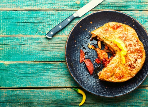 Mexican pie with smoked sausage and chicken. Meat pie.Space for text