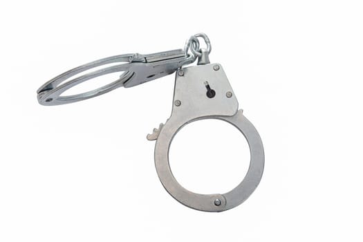 Metal handcuffs on a white isolated background, copy space. High quality photo