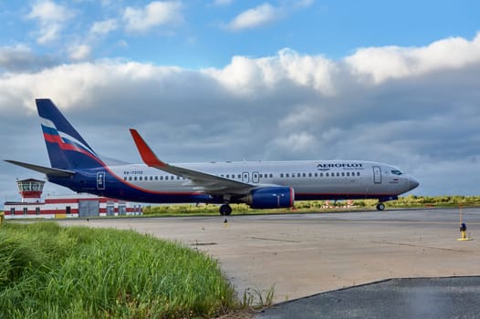 The Boeing aircraft is taxiing along the runway. Talagi Airport, Arkhangelsk, Russia, 27,08,2022. High quality photo