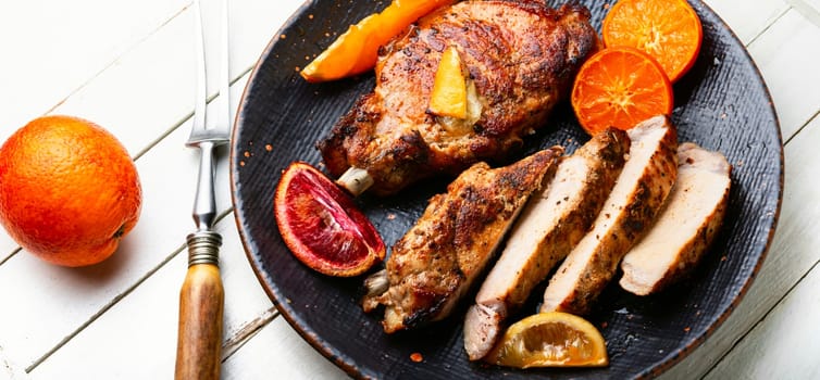 Pork cutlet on the bone grilled in oranges, lime and tangerine.