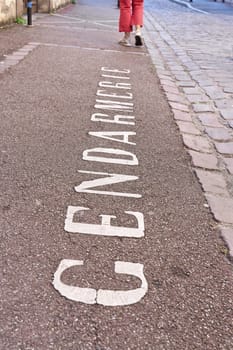 Writing Gendarmerie on a parking lot in front of a police station in Colmar in France