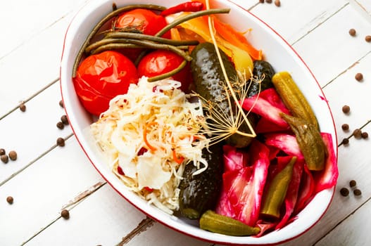 Assorted of pickles from tomato, sauerkraut, okra, cucumbers and cowpea. Pickles and marinated vegetables