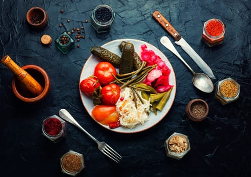 Assorted of pickles from tomato, sauerkraut, okra, cucumbers and cowpea. Pickles and marinated vegetables