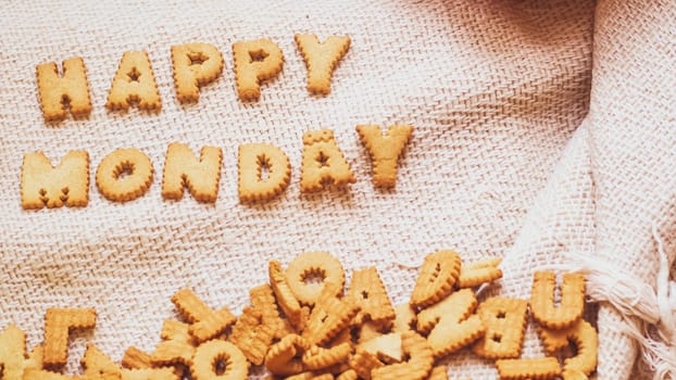 Cookies in the form of the alphabet prospect .Happy from homemade cookies on dark white background. Happy cookies concept.