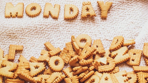 Cookies in the form of the alphabet prospect .Happy from homemade cookies on dark white background. Happy cookies concept.