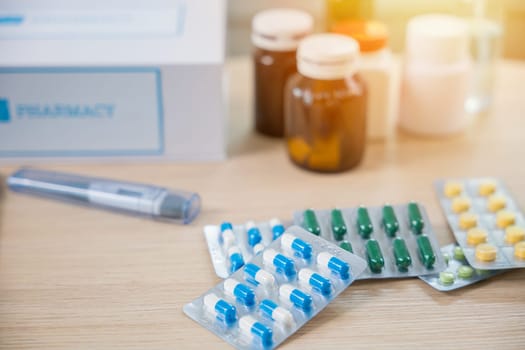 Online purchase delivery of medicines to your home from drugstore, Home medicine with medicine package box free first aid kit with pills from pharmacy hospital delivery service on table in living room