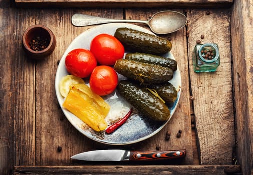 Homemade pickled cucumbers and tomatoes, homemade pickles. White background