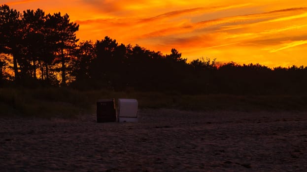 sunset on the beach of the baltic sea in zingst. warm light atmosphere. resort