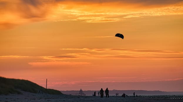 sunset on the beach of the baltic sea in zingst. warm light atmosphere. resort