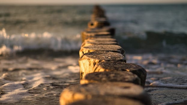 the Baltic Sea through the sea to the horizon at sunset. Romantic mood on vacation in Zingst