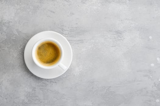Overhead view of porcelain cup of strong coffee