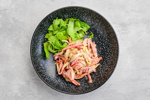 Overhead view of salad with pulled beef and vegetables