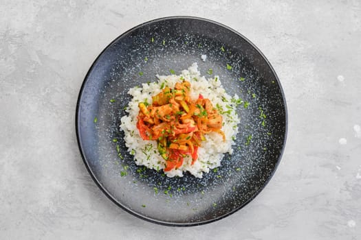 Top view of pulled beef with steamed bell pepper, zucchini and boiled rice