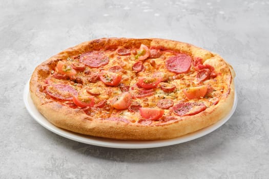 Pizza pepperoni with two kind of sausages on a plate