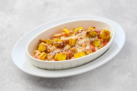 Hot casserole with chicken, pumpkin, bell pepper and potatoes