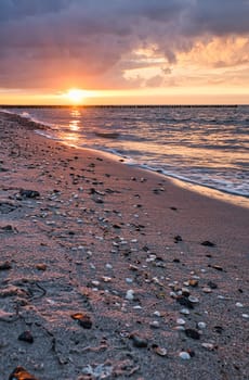 Sunset on the Baltic Sea. Sea, bean strong colors. Vacation on the beach. Romantic mood on the darss. Landscape photo.