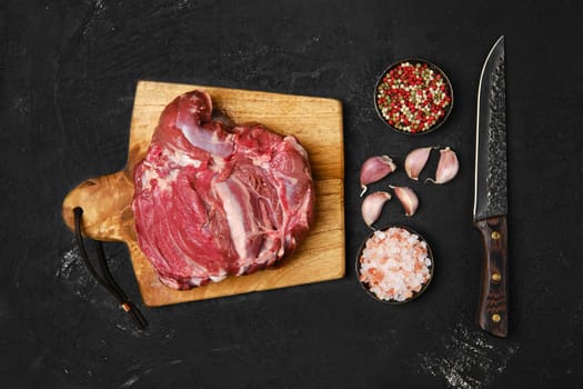 Top view of raw lamb cump ready for cooking on the kitchen table