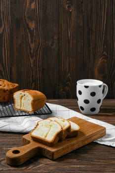 Fresh biscuit cake with apple on wooden table