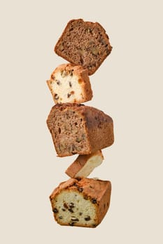 Stacked pieces of biscuit cupcakes. Balancing cakes.