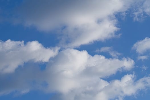 Clouds illuminated by the sun in the sky as background. Background image for further editing