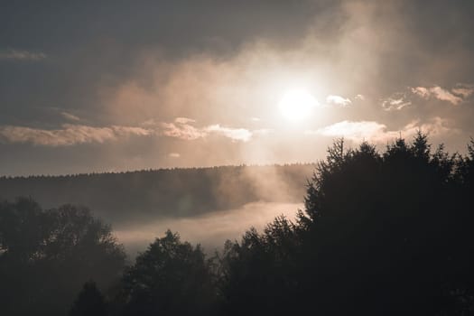 sunrise with fog in the early morning hours. mystical atmosphere. Taken in Saarland in beautiful landscape