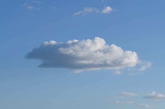 Clouds illuminated by the sun in the sky as background. Background image for further editing