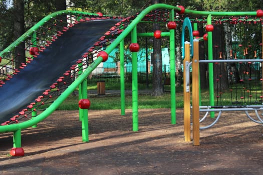 Children's playground with sports equipment in the city park. The concept of a healthy lifestyle.